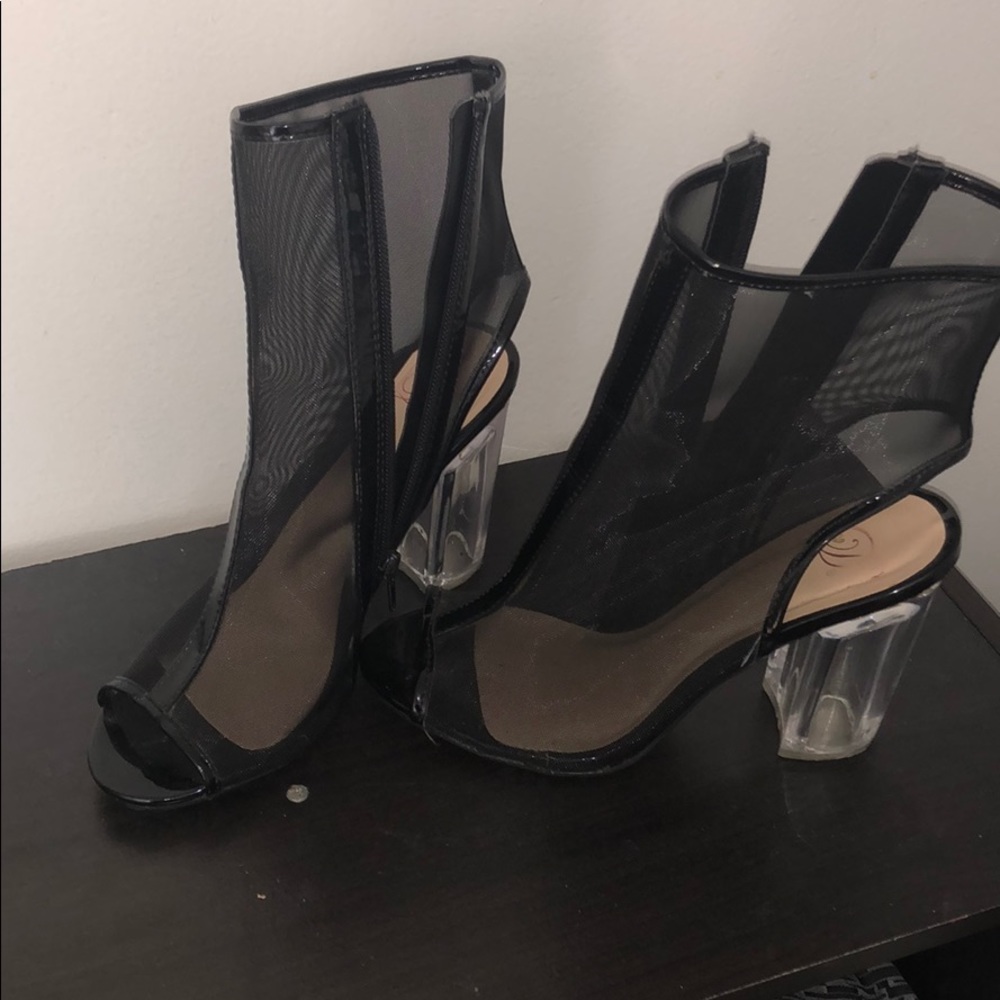 Black netted high heel shoes